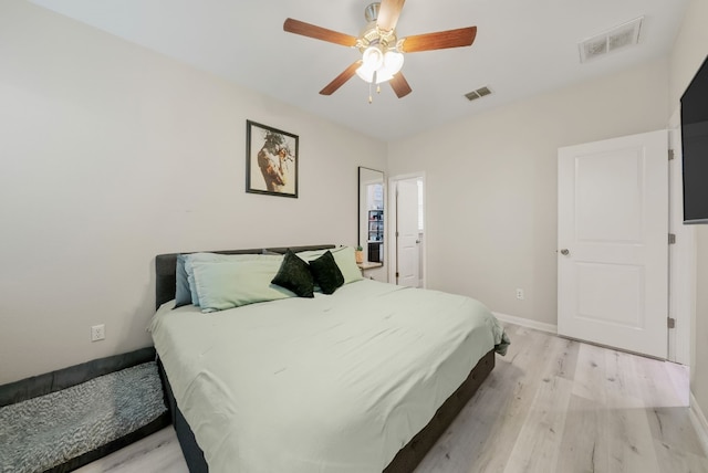 bedroom with light wood-type flooring and ceiling fan