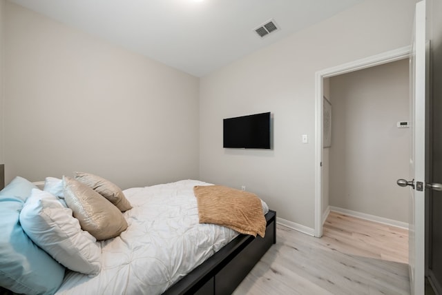 bedroom with light hardwood / wood-style flooring