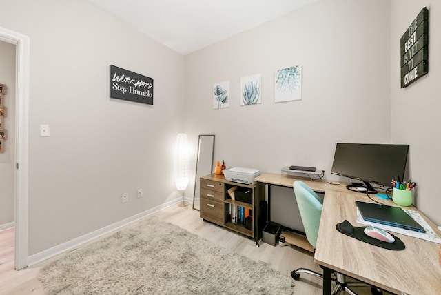 office area with light hardwood / wood-style flooring