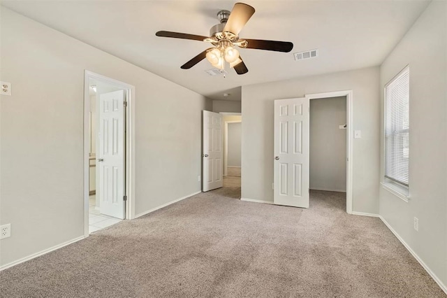 unfurnished bedroom with light carpet and ceiling fan