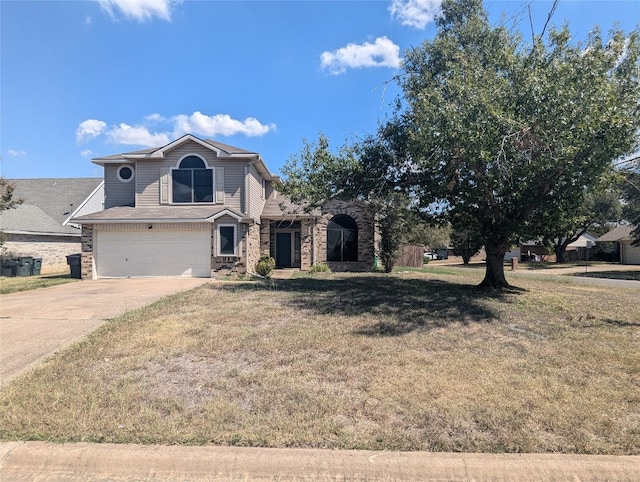 front facade with a front yard and a garage