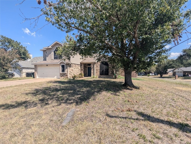 view of front of property with a garage and a front yard