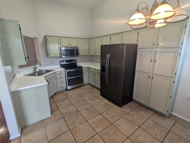 kitchen featuring hanging light fixtures, light tile patterned flooring, sink, and stainless steel appliances