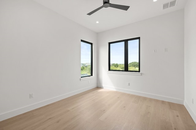 spare room featuring ceiling fan and light wood-type flooring