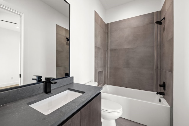 full bathroom featuring vanity, toilet, and tiled shower / bath