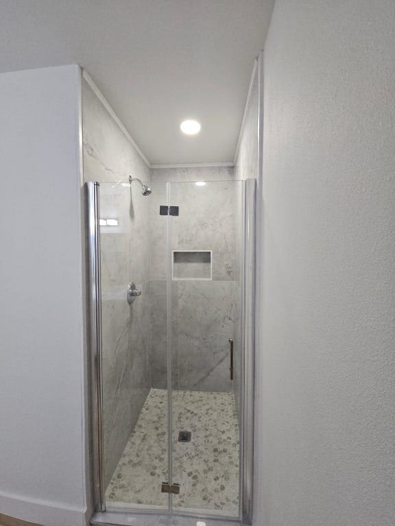 full bathroom with a shower stall