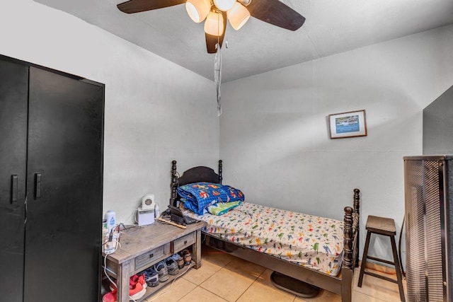 bedroom featuring ceiling fan and light tile patterned floors