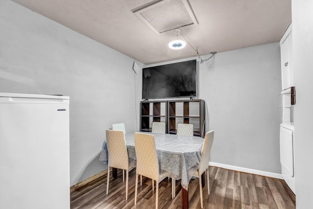 dining space featuring hardwood / wood-style flooring