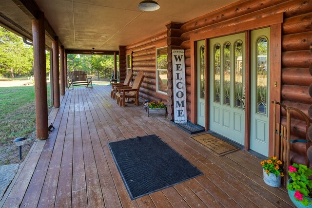 wooden terrace with a porch