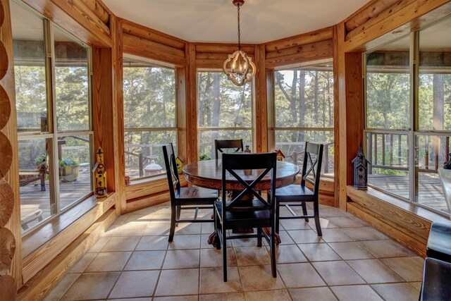 sunroom with a notable chandelier