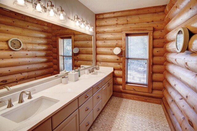 bathroom featuring vanity, rustic walls, and a wealth of natural light