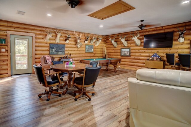 game room featuring rustic walls, light hardwood / wood-style floors, and pool table