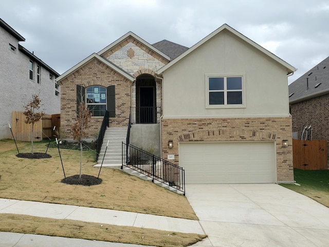 view of front of property with a garage and a front lawn