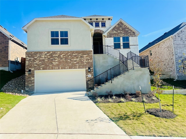 view of front facade with a garage and a front lawn