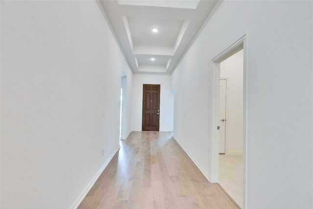 1425 Cole Estates Dr, Georgetown, TX 78628 - hallway featuring light wood-style floors, baseboards, recessed lighting, and a tray ceiling
