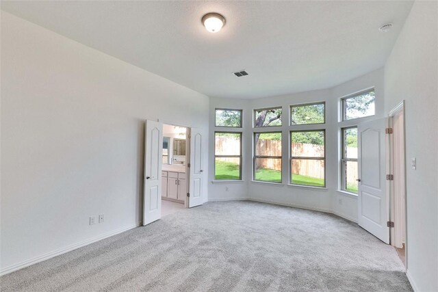 1425 Cole Estates Dr, Georgetown, TX 78628 - unfurnished room featuring light colored carpet, baseboards, and a smoke detector