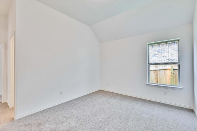 1425 Cole Estates Dr, Georgetown, TX 78628 - additional living space featuring vaulted ceiling, carpet flooring, and baseboards