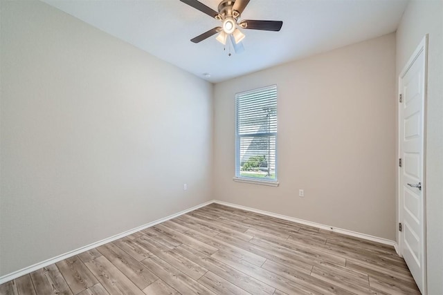 empty room featuring light wood-type flooring and ceiling fan