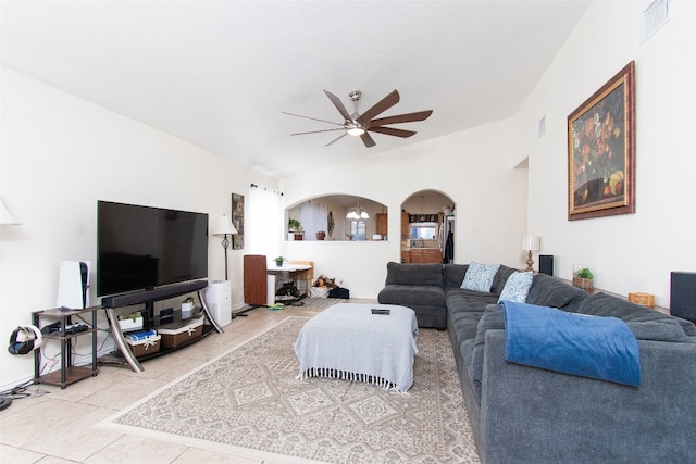 living room with ceiling fan and tile patterned flooring