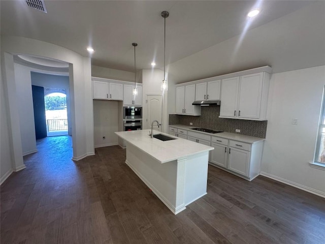 kitchen with white cabinets, a kitchen island with sink, sink, and appliances with stainless steel finishes