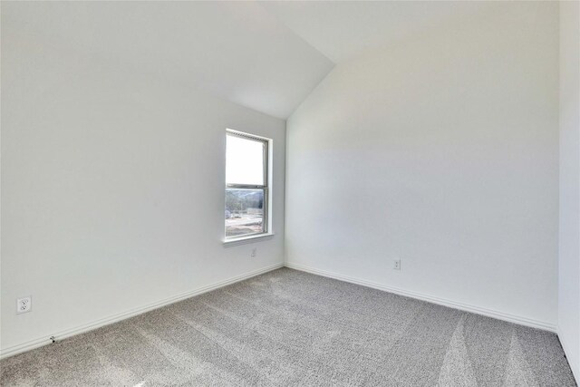 1429 Cole Estates Dr, Georgetown, TX 78628 - carpeted empty room featuring lofted ceiling and baseboards