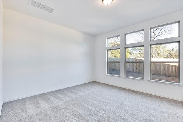 empty room featuring carpet flooring