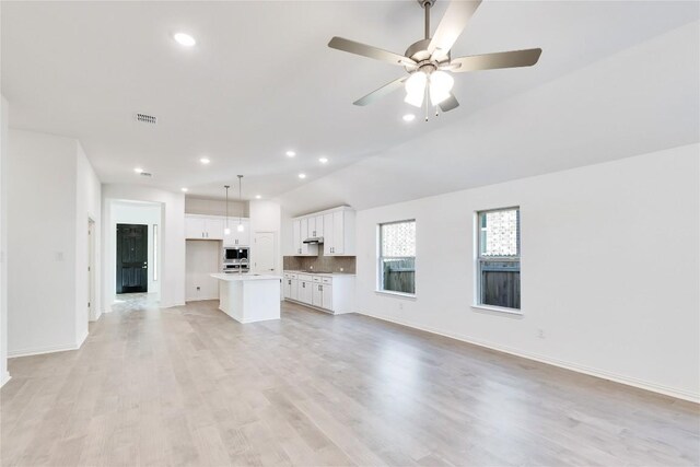 1429 Cole Estates Dr, Georgetown, TX 78628 - unfurnished living room with light wood-type flooring, baseboards, recessed lighting, and a ceiling fan