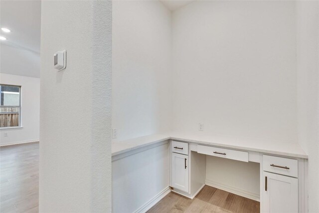 1429 Cole Estates Dr, Georgetown, TX 78628 - unfurnished office featuring light wood-style floors, built in study area, recessed lighting, and baseboards