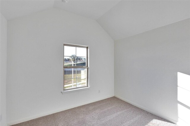 1429 Cole Estates Dr, Georgetown, TX 78628 - carpeted empty room with lofted ceiling and baseboards