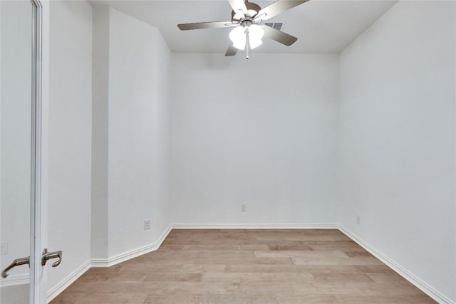 empty room featuring ceiling fan and light wood-type flooring