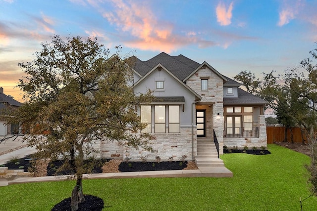 view of front of house with a lawn