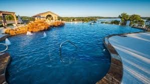 view of pool featuring a water view