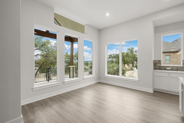 unfurnished sunroom featuring plenty of natural light