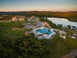 aerial view at dusk with a water view