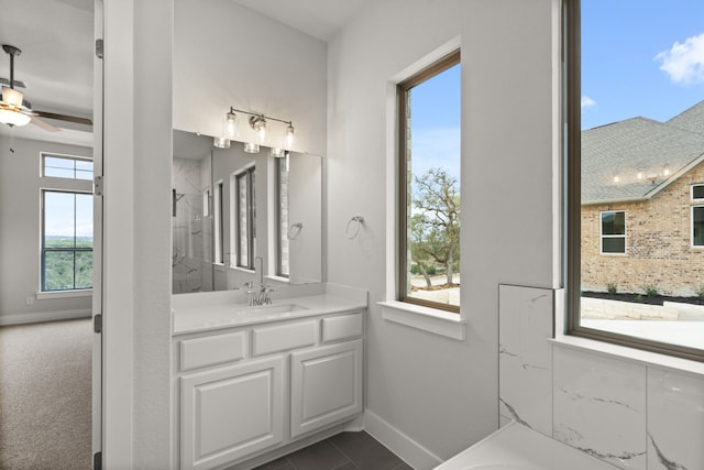 bathroom featuring vanity, a shower, tile patterned floors, and ceiling fan