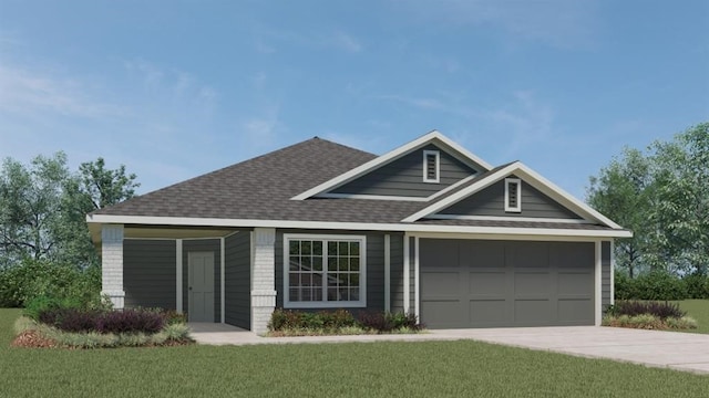 view of front of home with a front yard and a garage