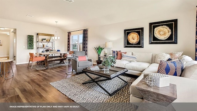 living room with a notable chandelier and dark hardwood / wood-style flooring