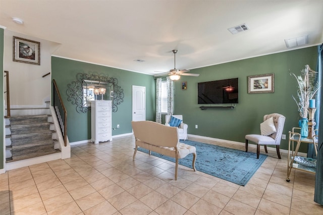 living area featuring light tile patterned floors and ceiling fan