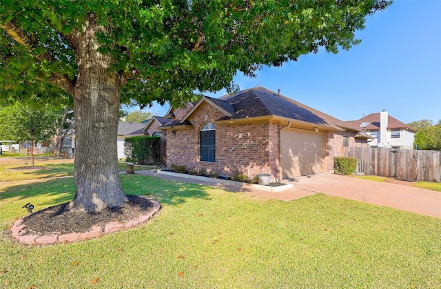 single story home with a garage and a front lawn