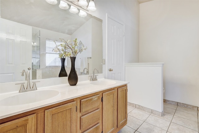 bathroom featuring walk in shower, vanity, and tile patterned floors