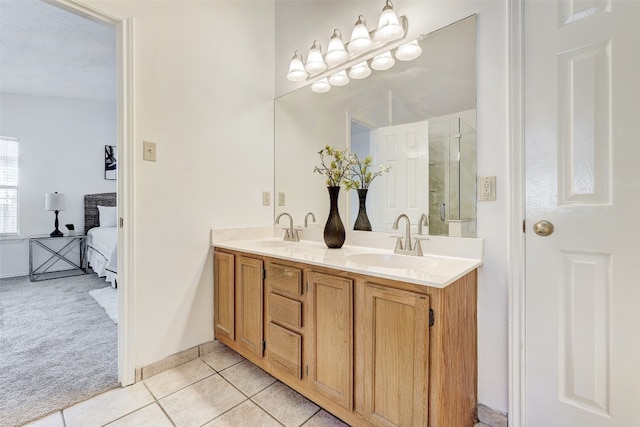 bathroom featuring walk in shower, tile patterned flooring, and vanity