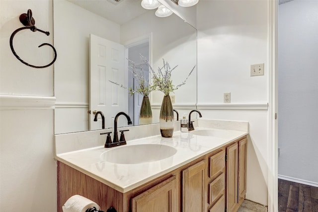 bathroom featuring wood-type flooring and vanity