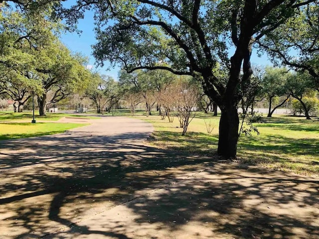 view of home's community featuring a lawn