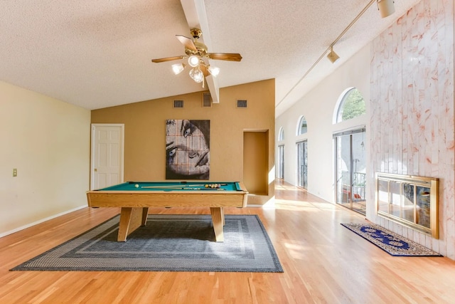 rec room featuring ceiling fan, a textured ceiling, hardwood / wood-style flooring, billiards, and vaulted ceiling