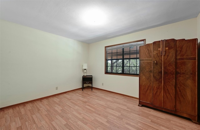 spare room featuring light wood-type flooring