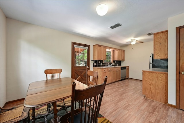 dining area featuring ceiling fan and light hardwood / wood-style floors