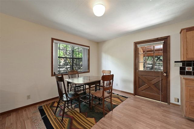 dining area featuring light wood-type flooring