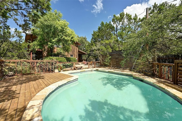 view of pool featuring a wooden deck