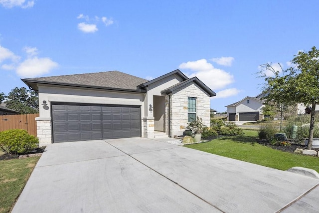 view of front facade with a garage and a front yard