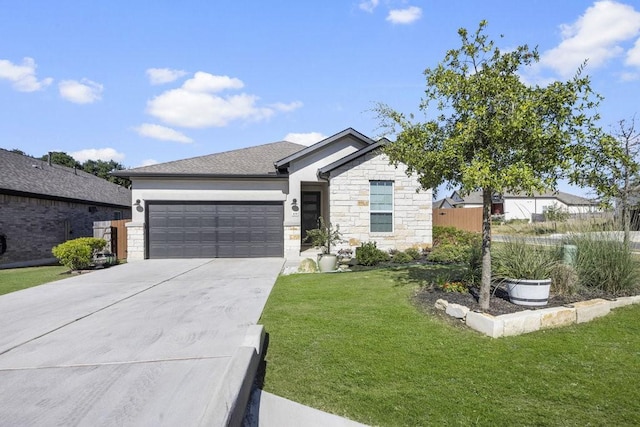 view of front of home with a garage and a front yard